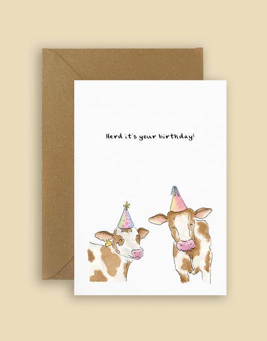 Funny Irish birthday card with hand-illustrated cows wearing party hats and 'Herd It’s Your Birthday' pun. Perfect for animal lovers and pun cards.